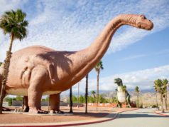Deno 2.Four restores JavaScript bundling subcommand shutterstock 1591493512 dinosaur roadside attraction brontosaurus T Rex clouds blue sky