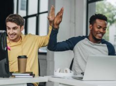 Zoneless Angular arrives in Angular 20.2 happy multicultural programmers developers giving high five while working in office together