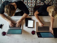 OpenAI seeks to automate ‘computer use’ for Macs within the… Coworkers using Mac laptops shot from above