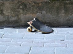 It’s the tip of vibe coding, already Half a broken skateboard rests on a gray cobblestone path.