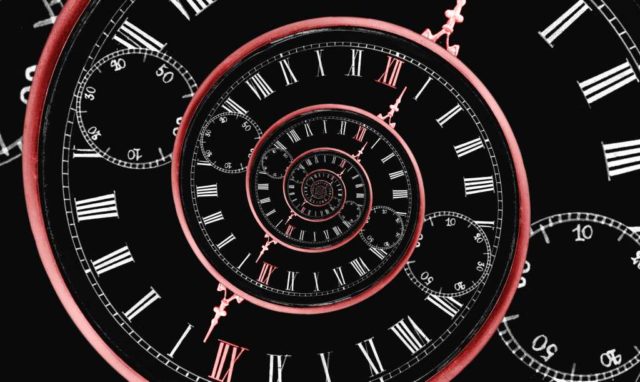 Back-to-the-future-The-most-popular-JavaScript-stories.jpg Reversed infinity time spiral; a digital image of a stopwatch with a black background and red spiral representing infinity backward.