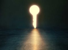 The hidden devops disaster that AI workloads are about to… Light glows through key shaped hole in dark empty room. Golden key concept