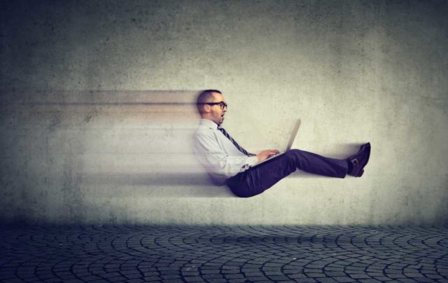 Claude-Code-is-blowing-me-away.jpg businessman zooming through air with laptop