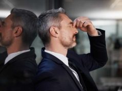 The treatment for the AI hype hangover Window, business man and stress or headache, burnout and overworked in office. Senior male, entrepreneur and ceo frustrated, mental health and leader with depression, pain and tired in workplace