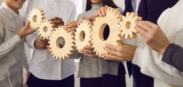 AI-agents-arent-failing.-The-coordination-layer-is.jpg shutterstock 1869308242 team putting together a chain of gears teamwork coordination collaboration
