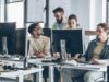 Notion courts builders with a platform for AI brokers a… Group of programmers and software developers working on a new project at the office.
