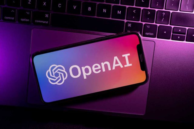 US-tells-OpenAI-to-restrict-access-to-its-most-powerful.jpg Azores, Portugal - 21.01.2023: SmartPhone on top of laptop keyboard with OpenAI Logo on the screen.