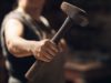 When software program builders and AI brokers share the… Woman, hand and holding hammer with small business for crafting metal and object at workshop. Female person, blacksmith and empowerment or affirmative action for welder work, welding and industrial
