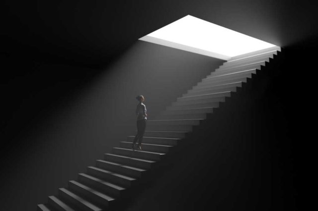 How-to-make-Windows-a-proper-development-environment.jpg A woman climbs steps from darkness toward light.