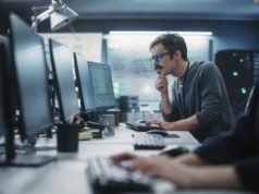 A short information to AI-powered software program growth… Portrait of a Thoughtful Engineer Working on Desktop Computer in a Technological Office Environment. Research and Development Department Writing Software Code for an Innovative Internet Project
