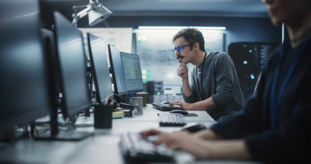 A-brief-guide-to-AI-powered-software-development.jpg Portrait of a Thoughtful Engineer Working on Desktop Computer in a Technological Office Environment. Research and Development Department Writing Software Code for an Innovative Internet Project