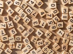 Rust language provides algebraic floating-point strategies shutterstock 1912506373 scattered wooden tiles with numbers and signs