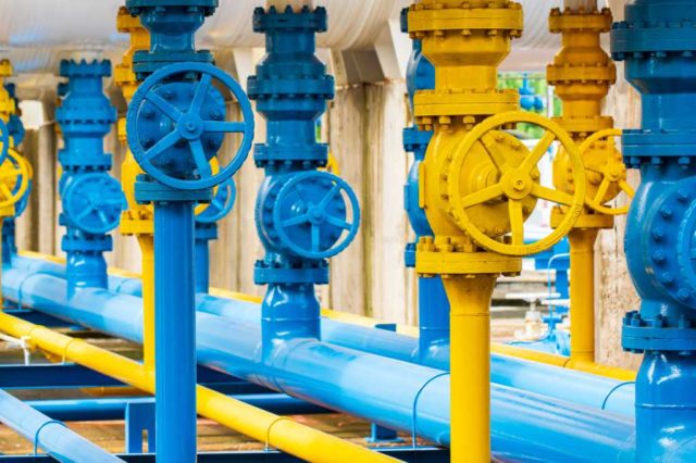 Why-your-biggest-hidden-AI-cost-isn’t-GPUs.jpg shutterstock 1921909664 blue and yellow pipelines and valves at a gas plant